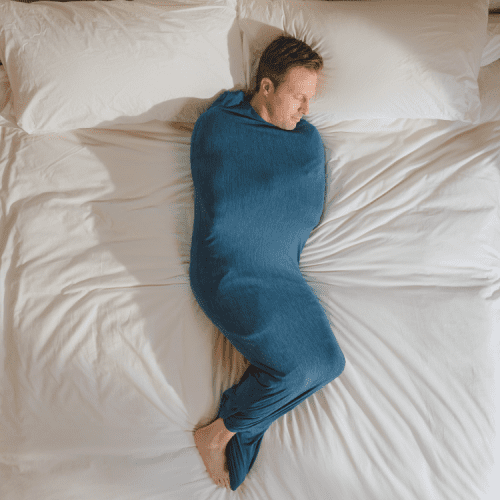 Turquoise#man in sleep pod in bed