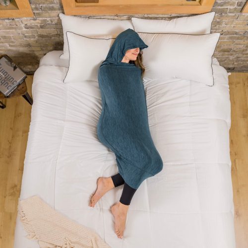 Turquoise#woman in sleep pod mini laying in bed