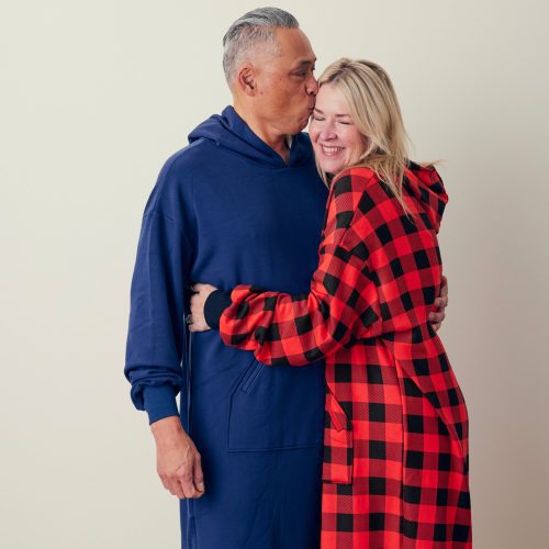 Man and woman wearing hug hoodie